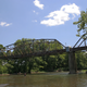 On a hot summer’s day, folks were swimming and fishing in the waters beneath the bridge